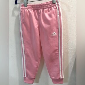 Adidas 3 stripe jogger style pants.